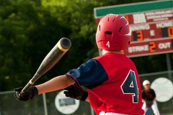 Back-to-School-Sports-Safety-Checklist young child playing baseball outdoors
