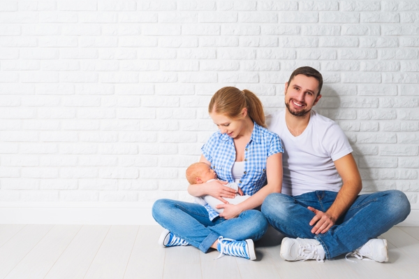 Family First Aid & Heart Safety in the Home Family sitting together in white home
